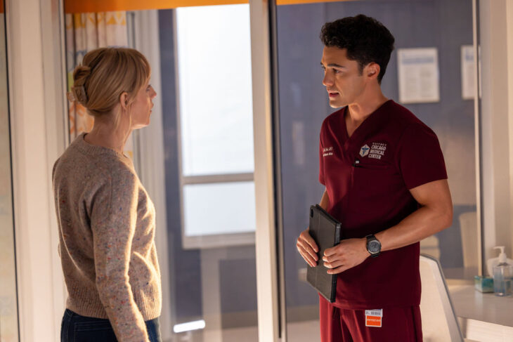 Chicago Med Season 11 Episode 4, "Found Family" - (l-r) Darren Barnet as Dr. John Frost and Erin Davie as Vivienne Cooper