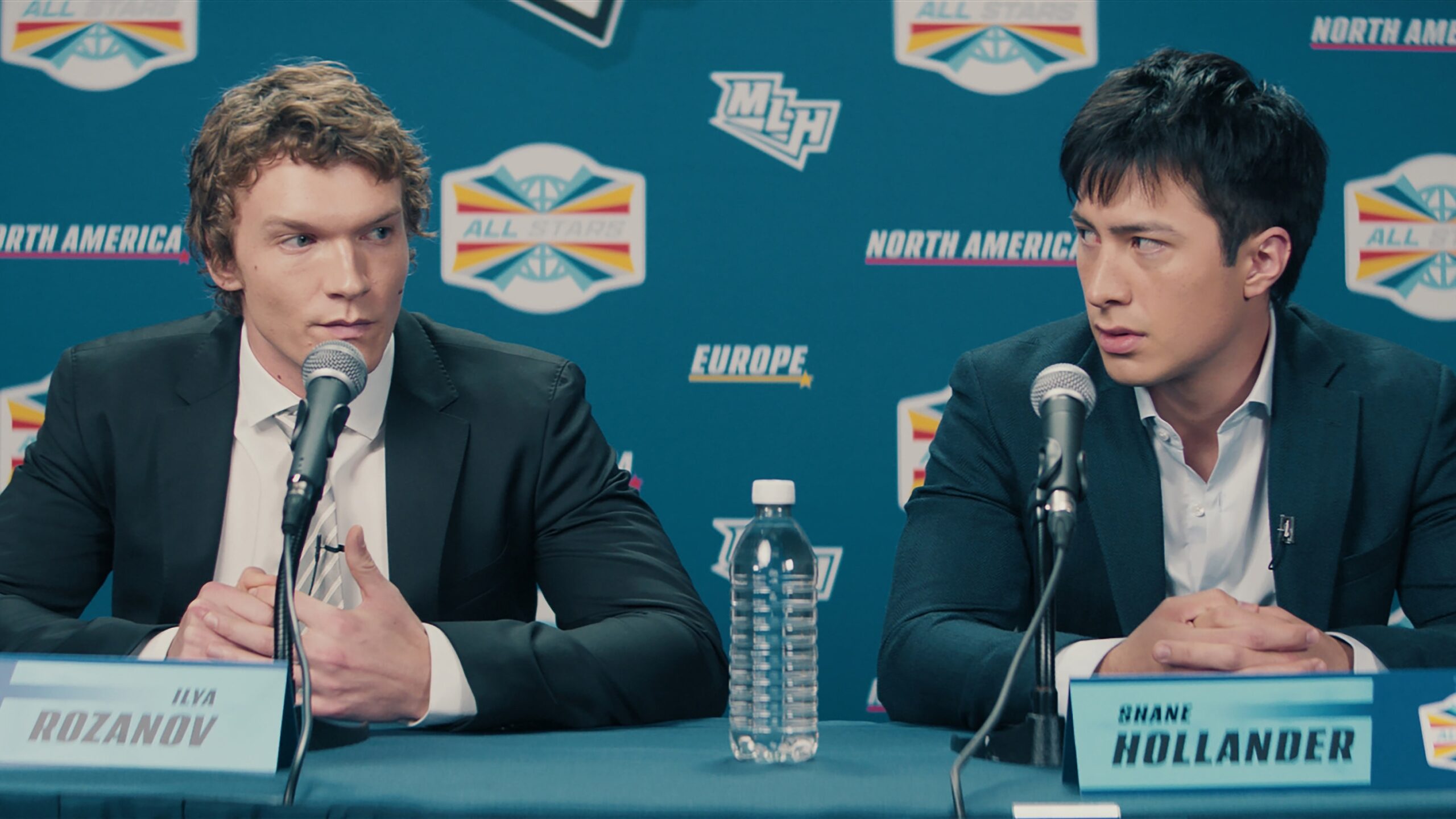 Heated Rivalry Season 1 - (l-r) Connor Storrie as Ilya Rozanov and Hudson Williams as Shane Hollander