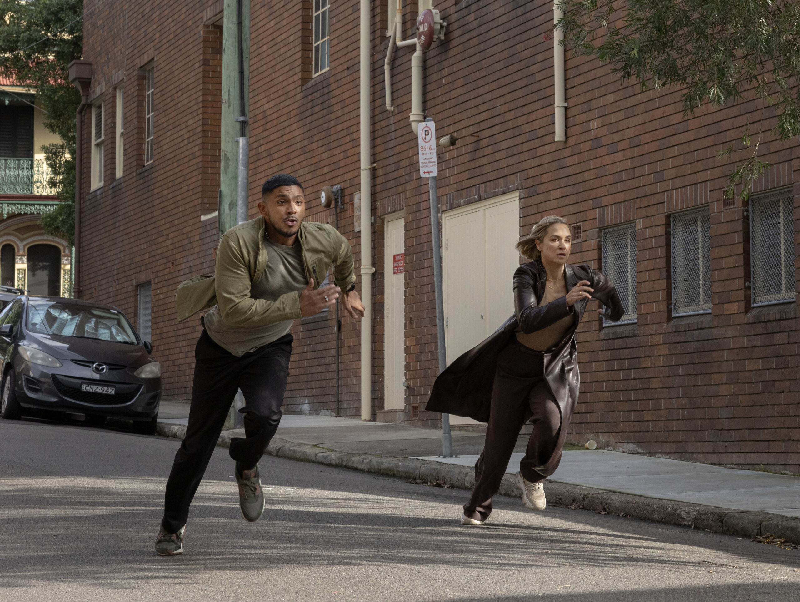 NCIS: Sydney Season 3 Episode 5, "Black Is White" -- Sean Sagar as NCIS Special Agent DeShawn Jackson and Tuuli Narkle as AFP Liaison Officer Constable Evie Cooper