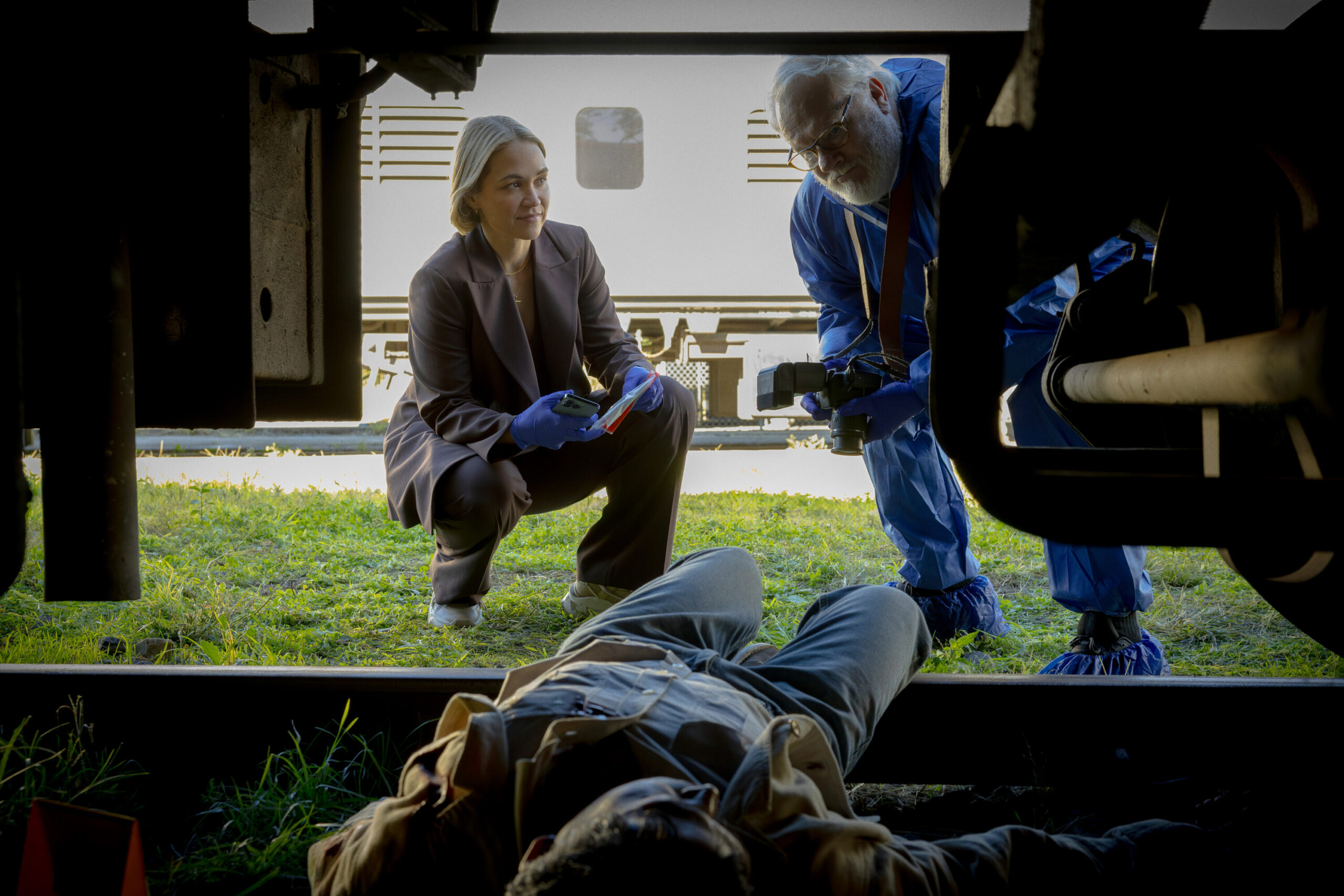 NCIS: Sydney Season 3 Episode 7, "Gold Digger" -- Tuuli Narkle as AFP Liaison Officer Constable Evie Cooper and William McInnes as Forensic Pathologist Dr. Roy Penrose