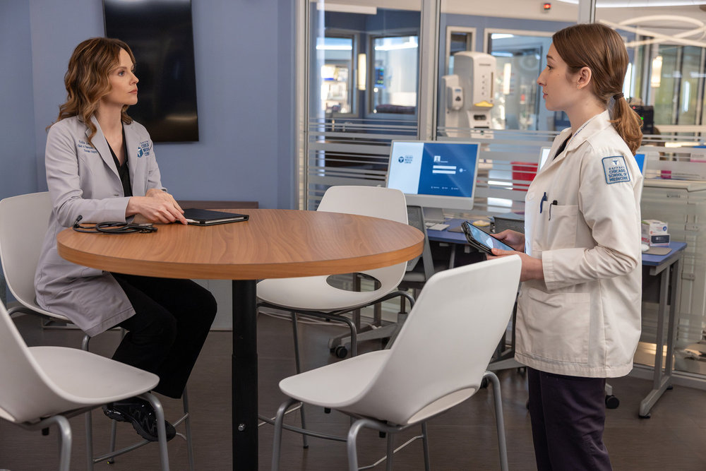 Chicago Med Season 11 Episode 7, "Double Down," - (l-r) Sarah Ramos as Dr. Caitlin Lenox and Abrial Bonilla as Med Student Lina Martinez