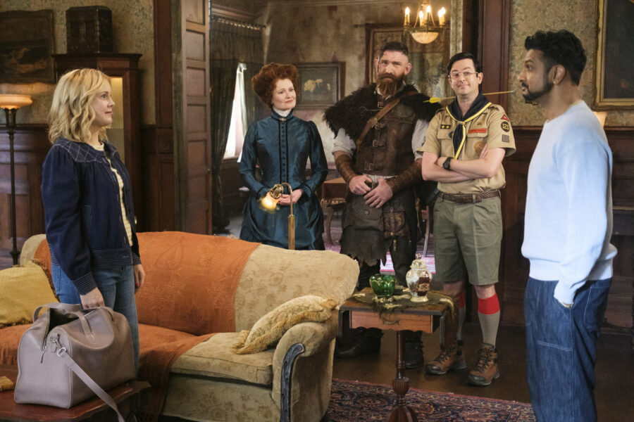 “The Others” – GHOSTS. Pictured L to R: Rose McIver as Samantha, Rebecca Wisocky as Hetty, Devan Chandler Long as Thorfinn, Richie Moriarty as Pete, Utkarsh Ambudkar as Jay. Photo: Bertrand Calmeau/CBS ©2025 CBS Broadcasting, Inc. All Rights Reserved.