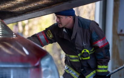 Taylor Kinney as Kelly Severide looking inside a car. Chicago Fire Season 14 Episode 10 Review: Carry a Torch - Part 2 