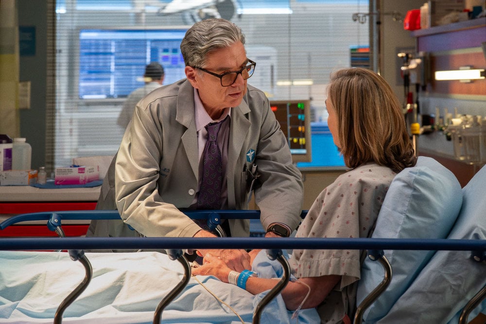 Oliver Platt as Dr. Daniel Charles talking to a patient.