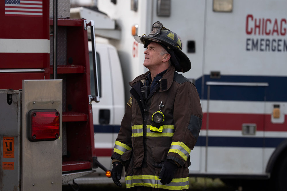 David Eigenberg as Christopher Herrmann standing by an ambulance.