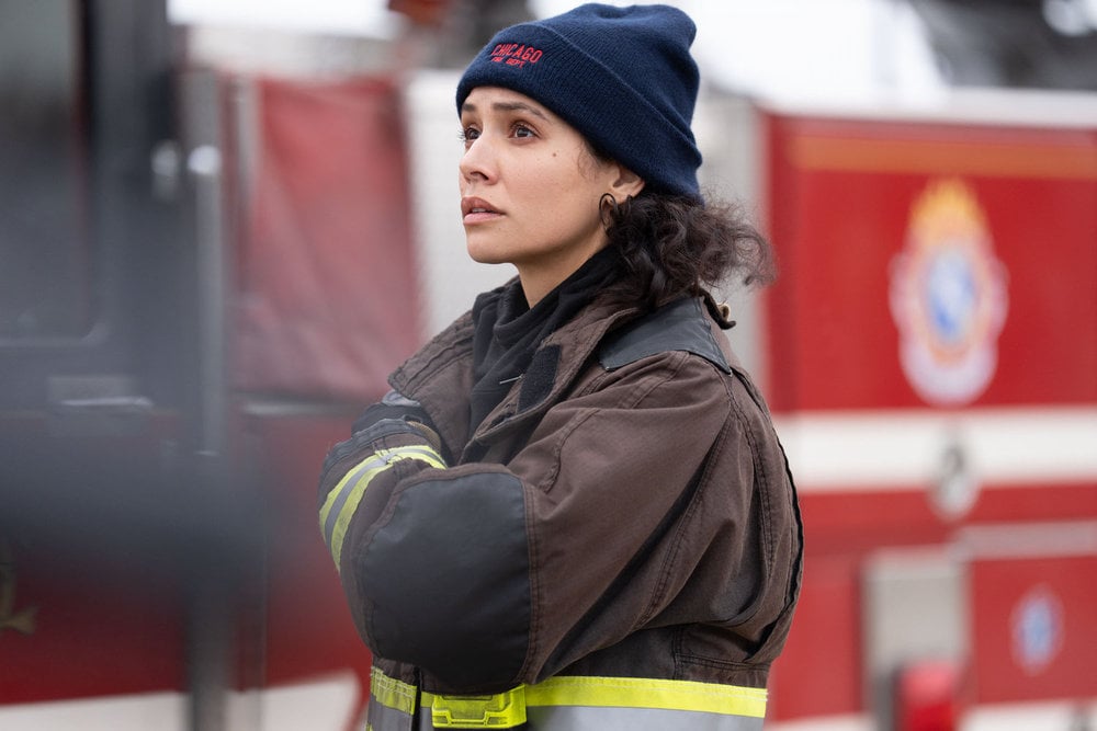 Miranda Rae Mayo as Stella Kidd standing in front of the firetruck.