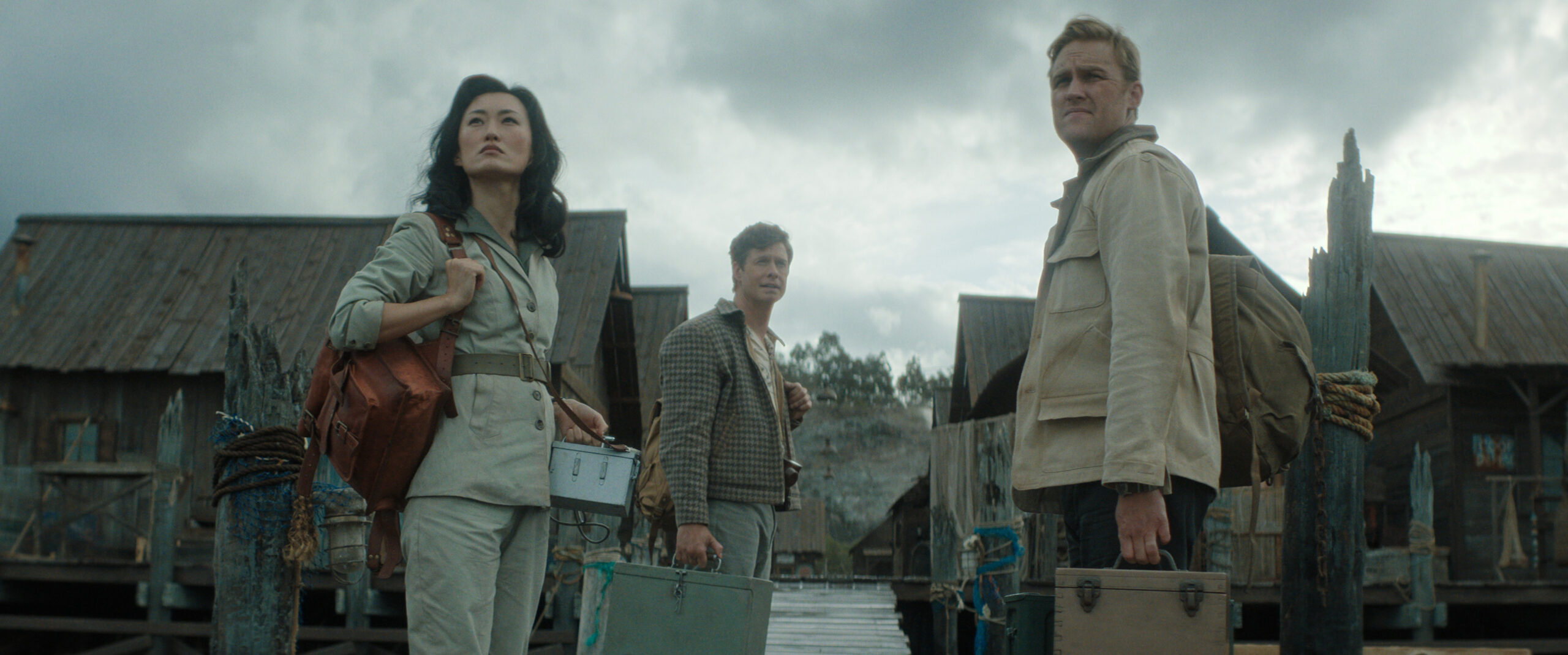 Monarch: Legacy of Monsters Season 2 Episode 7 - Mari Yamamoto, Anders Holm and Wyatt Russell | Tell-Tale TV Still from Monarch: Legacy of Monsters Season 2 Episode 7 of Mari Yamamoto, Anders Holm and Wyatt Russell pictured from left to right.