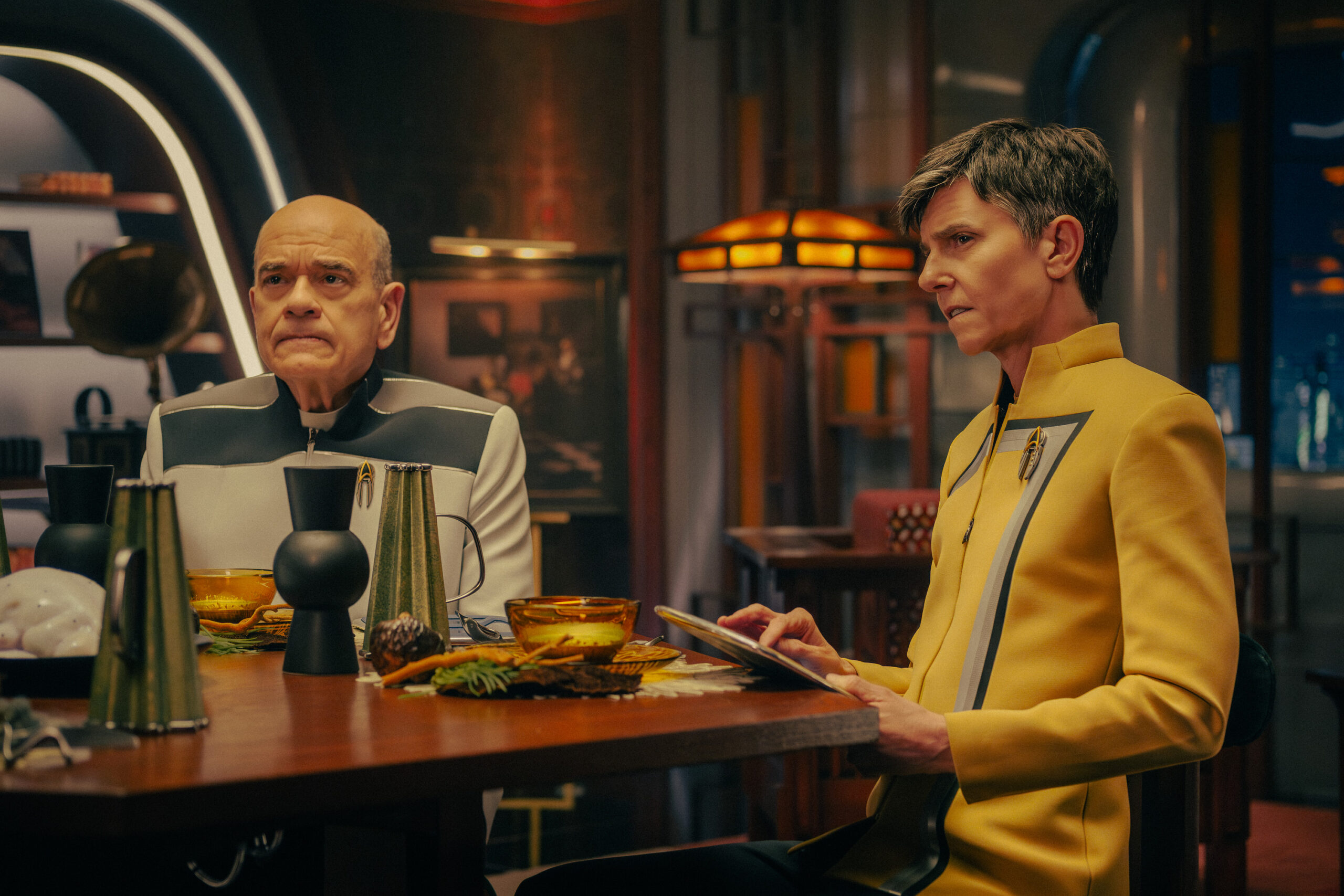 Still from Star Trek: Starfleet Academy Season 1 Episode 5 of Robert Picardo as The Doctor and Tig Notaro as Reno pictured from left to right.