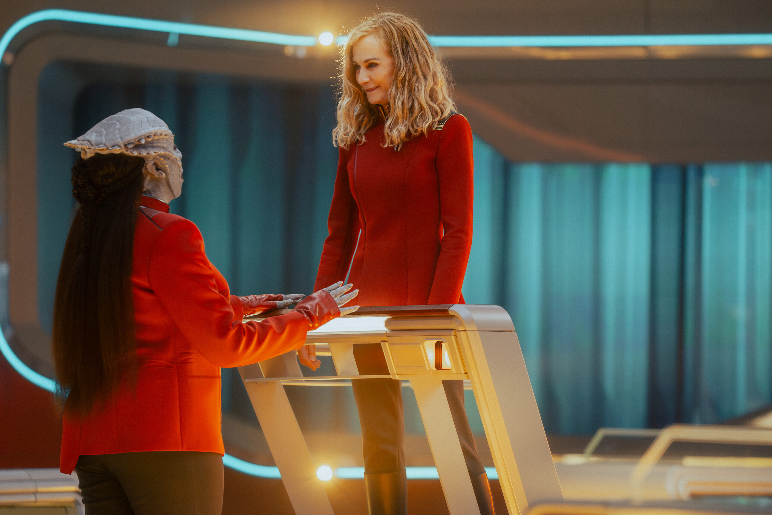 Still from Star Trek: Starfleet Academy Season 1 Episode 6 of Gina Yashere as Lura and Holly Hunter as Captain Nahla Ake pictured from left to right.