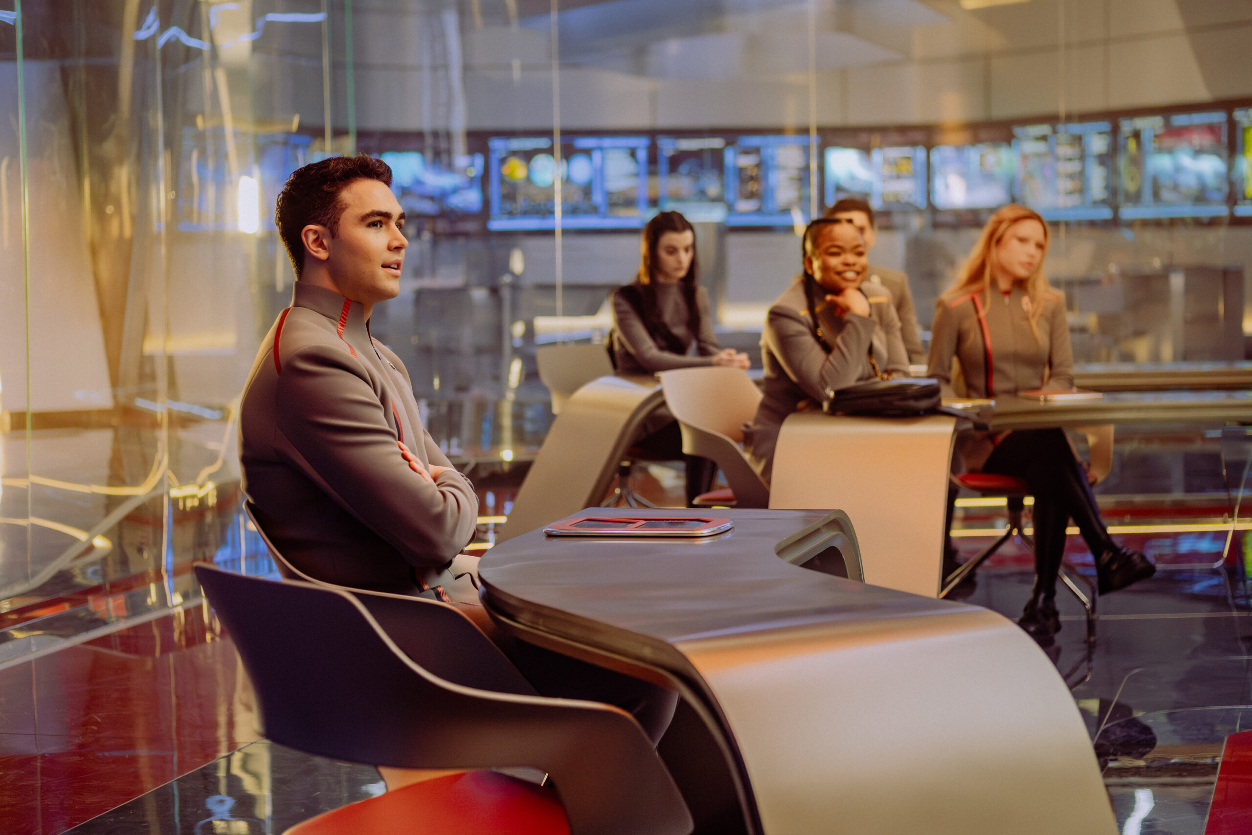 Still from Star Trek: Starfleet Academy Season 1 Episode 8 of George Hawkins as Daren, Zoë Steiner as Tarima, Kerrice Brooks as SAM, and Bella Shepard as Genesis pictured from left to right