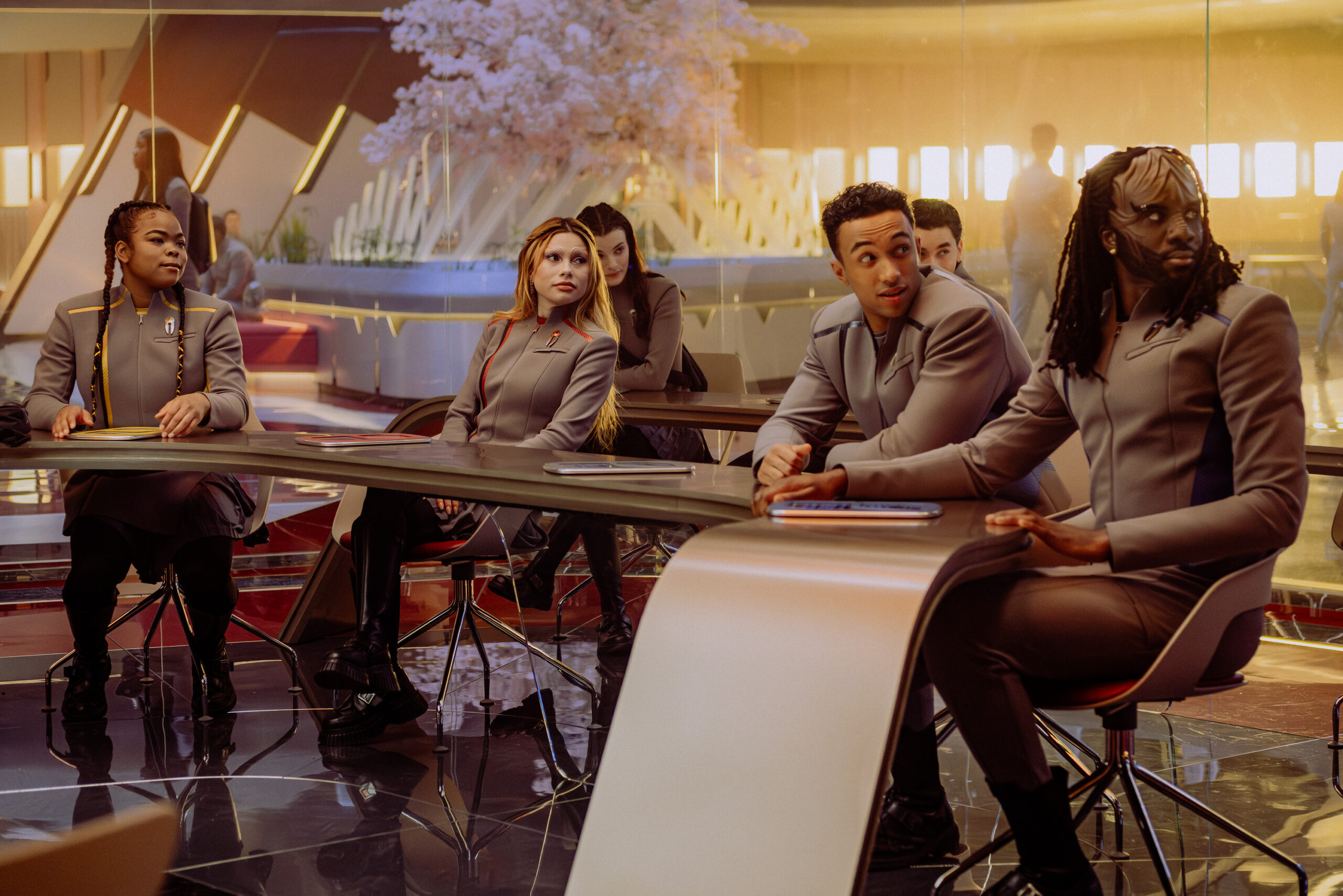 Still from Star Trek: Starfleet Academy Season 1 Episode of Kerrice Brooks as SAM, Bella Shepard as Genesis, Sandro Rosta as Caleb, and Karim Diané as Jay-Den pictured from left to right.