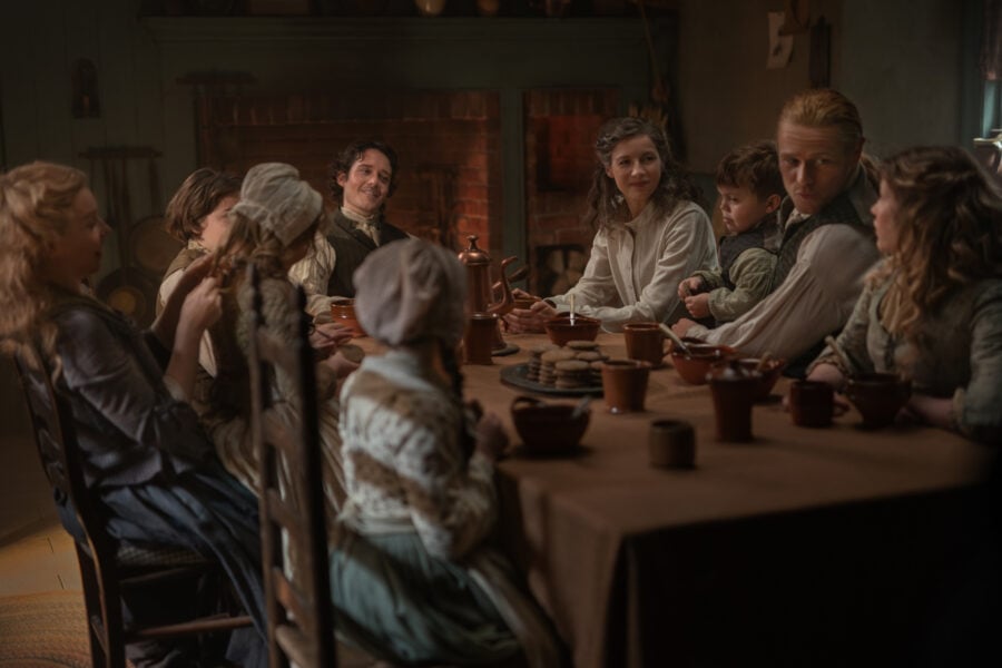 Outlander Season 8 - Lauren Lyle (“Marsali Fraser”), César Domboy (“Fergus Fraser”), Caitríona Balfe (“Claire Fraser”), Sam Heughan (“Jamie Fraser”), and Florrie May Wilkinson (“Fanny Pocock”) (Photo courtesy of STARZ)