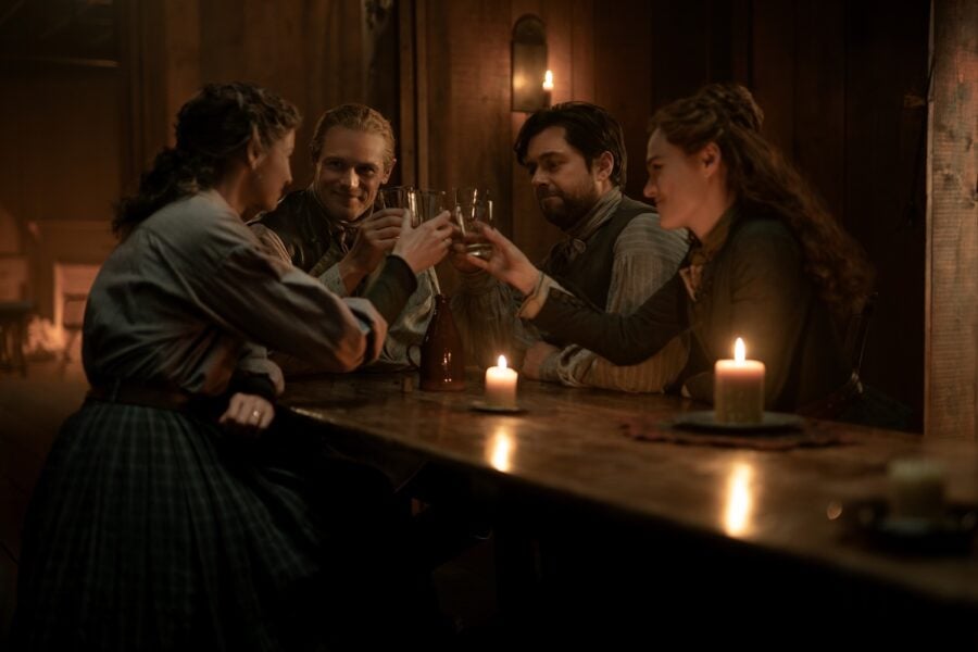 Outlander Season 8 — Caitríona Balfe (“Claire Fraser”), Sam Heughan (“Jamie Fraser”), Richard Rankin (“Roger MacKenzie”), and Sophie Skelton (“Brianna Fraser MacKenzie”). Photo Courtesy of STARZ