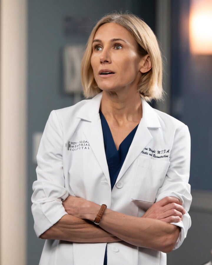 JEN LANDON as Dr. Toni Wright, arms crossed in white doctor jacket - Grey's Anatomy Season 22 Episode 12