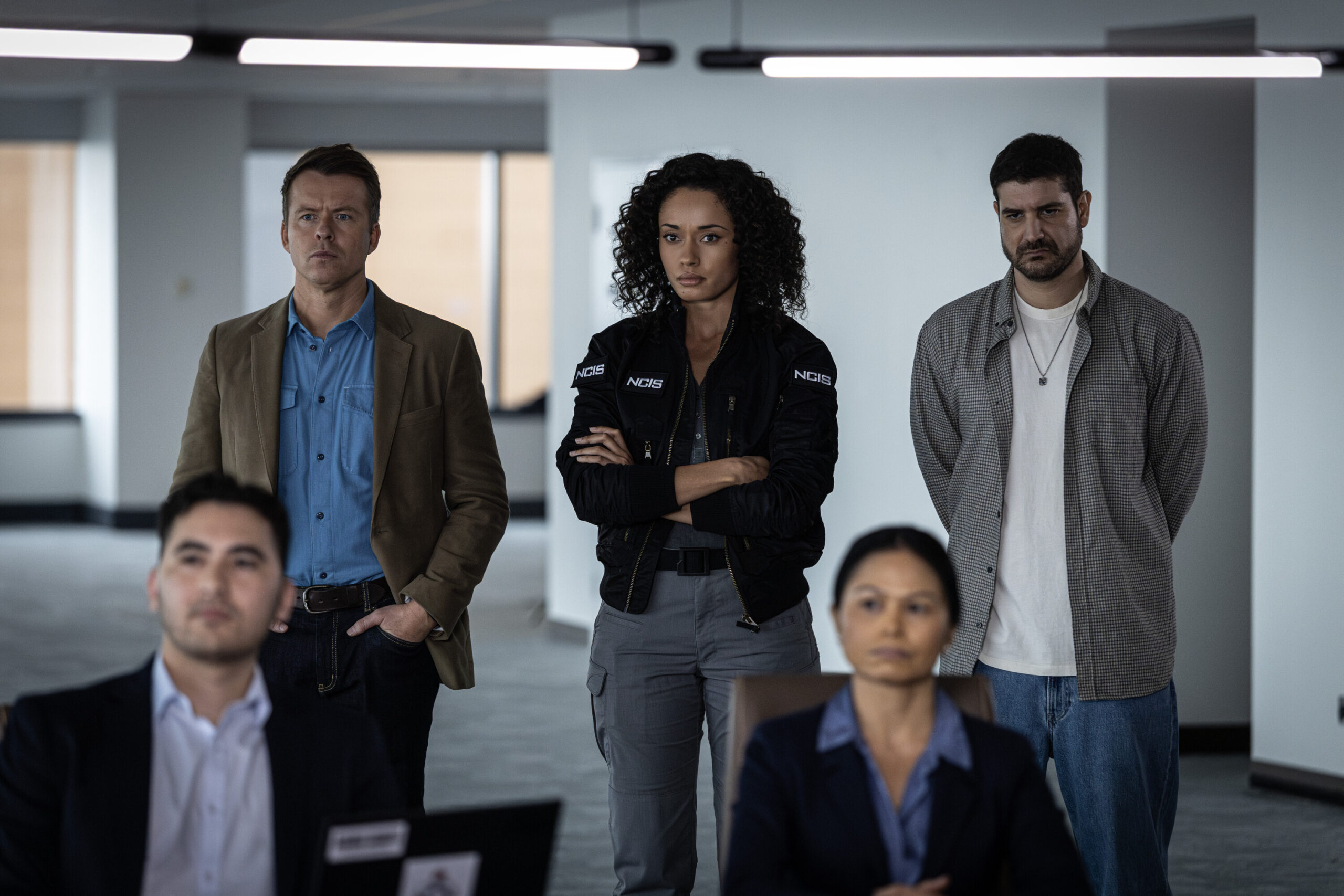 NCIS: Sydney Season 3 Episode 12, "Lone Wolf: Part One" -- Todd Lasance as AFP Liaison Officer Sergeant Jim 'JD' Dempsey, Olivia Swann as NCIS Special Agent Captain Michelle Mackey, and Claude Jabbour as Travis “Trigger”
