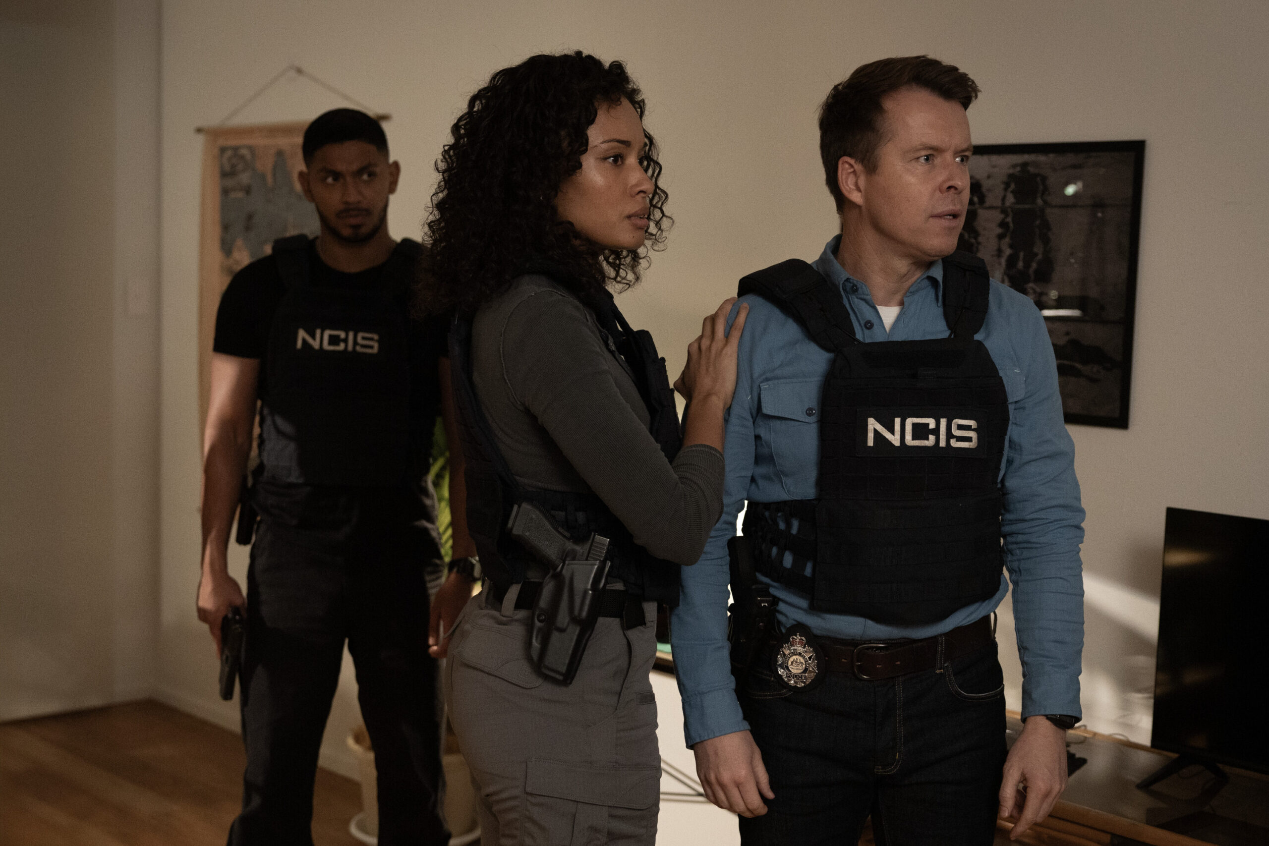NCIS: Sydney Season 3 Episode 12, "Lone Wolf: Part One" -- Sean Sagar as NCIS Special Agent DeShawn Jackson, Olivia Swann as NCIS Special Agent Captain Michelle Mackey, and Todd Lasance as AFP Liaison Officer Sergeant Jim 'JD' Dempsey