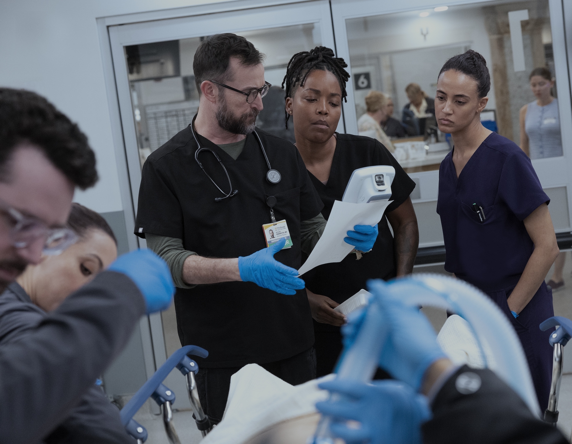 The Pitt Season 2 Episode 13 — Noah Wyle, Ayesha Harris, Alexandra Metz (Photograph by Warrick Page/HBO Max)