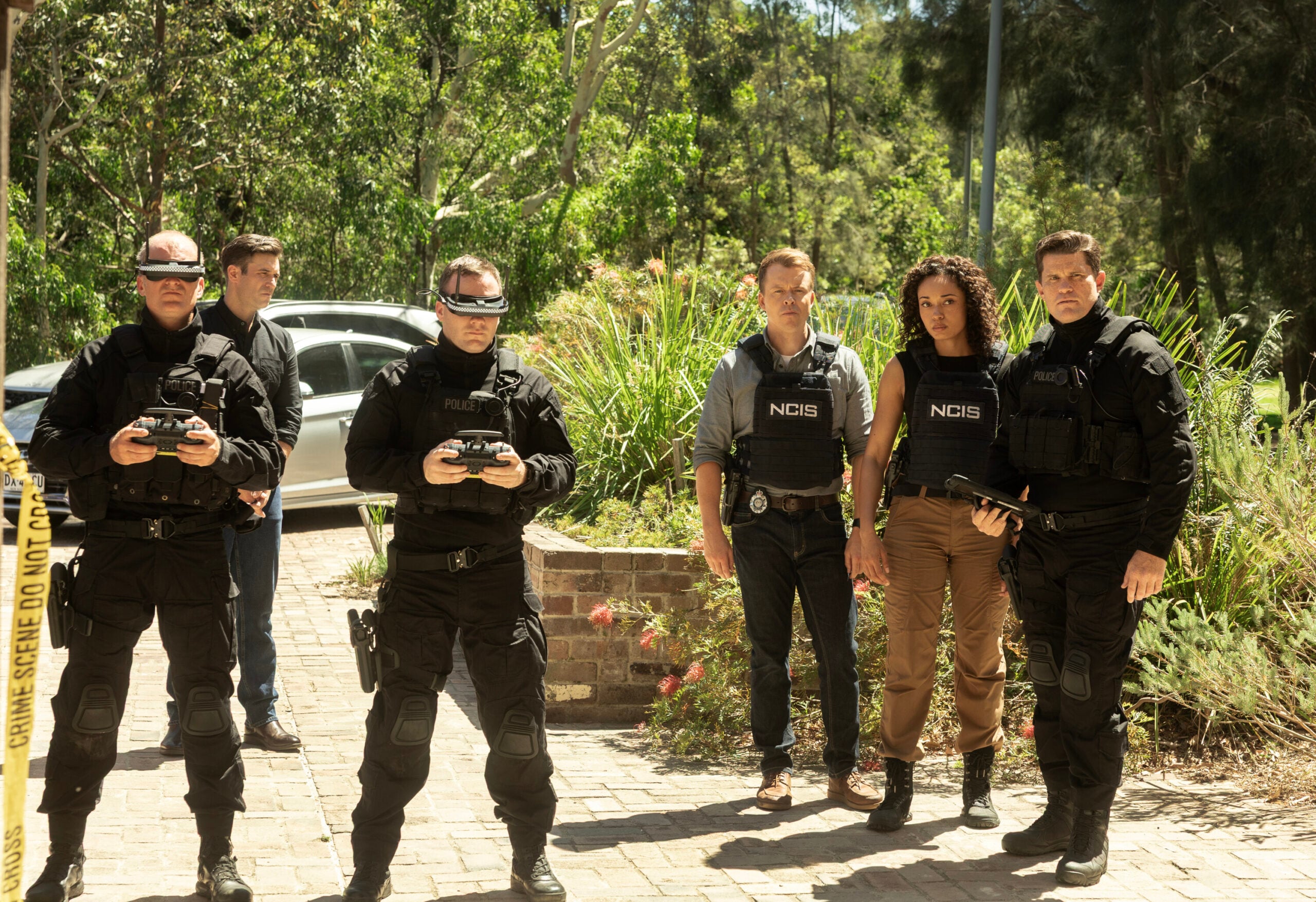 NCIS: Sydney Season 3 Episode 17, "Flight Club" -- Todd Lasance as AFP Liaison Officer Sergeant Jim 'JD' Dempsey, Olivia Swann as NCIS Special Agent Captain Michelle Mackey, and Mark Wales as State Police Tactical Leader