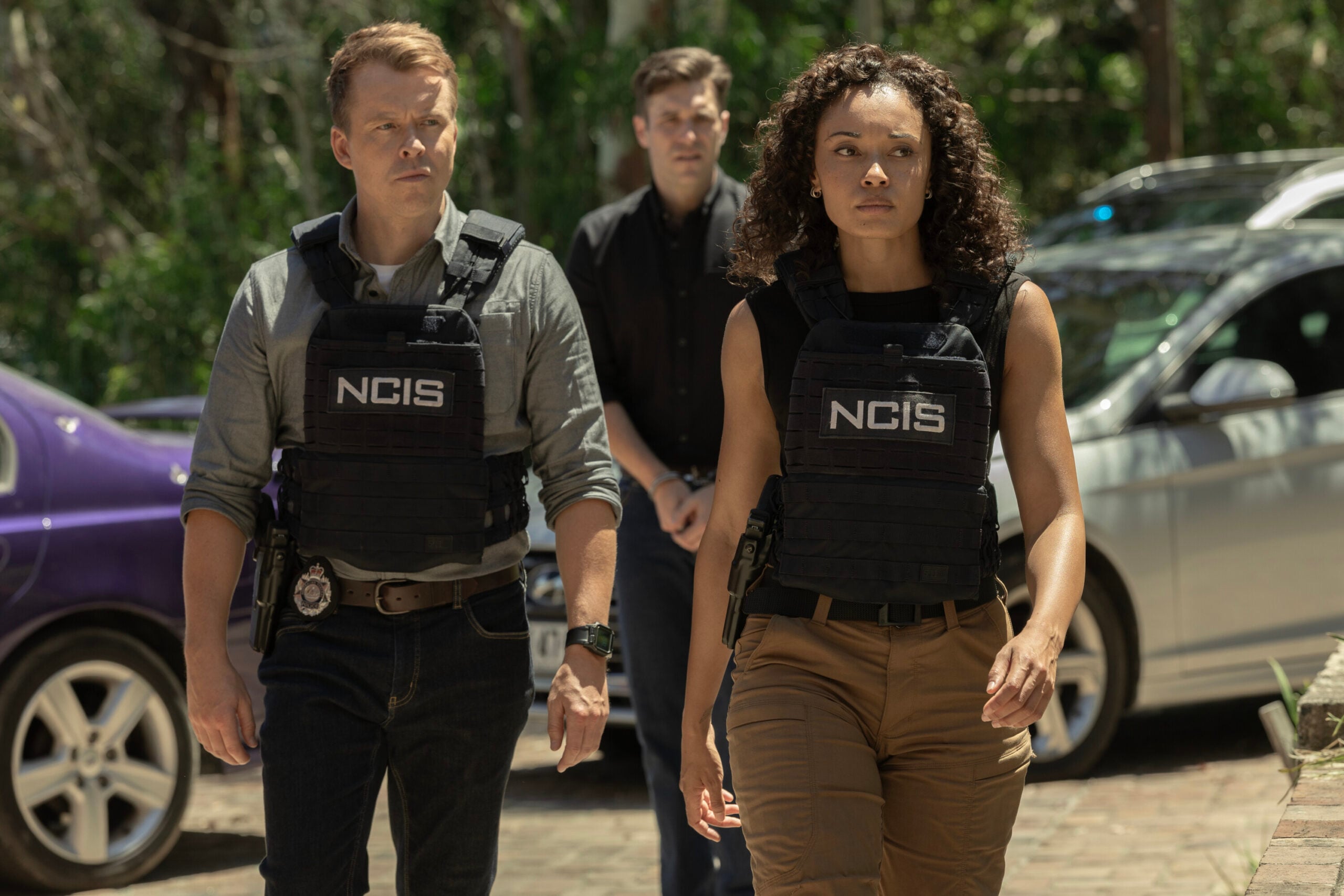 NCIS: Sydney Season 3 Episode 17, "Flight Club" -- Todd Lasance as AFP Liaison Officer Sergeant Jim 'JD' Dempsey, Nic English as Julian Black, and Olivia Swann as NCIS Special Agent Captain Michelle Mackey