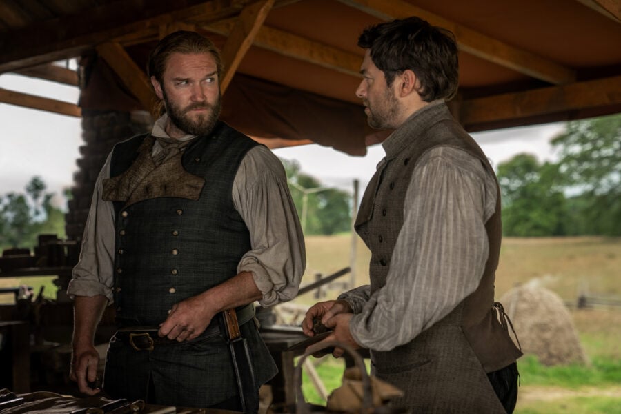 Outlander 808 — In the Forest, Left to Right: Dairmaid Murtagh (“Buck Mackenzie”) and Richard Rankin (“Roger MacKenzie”)