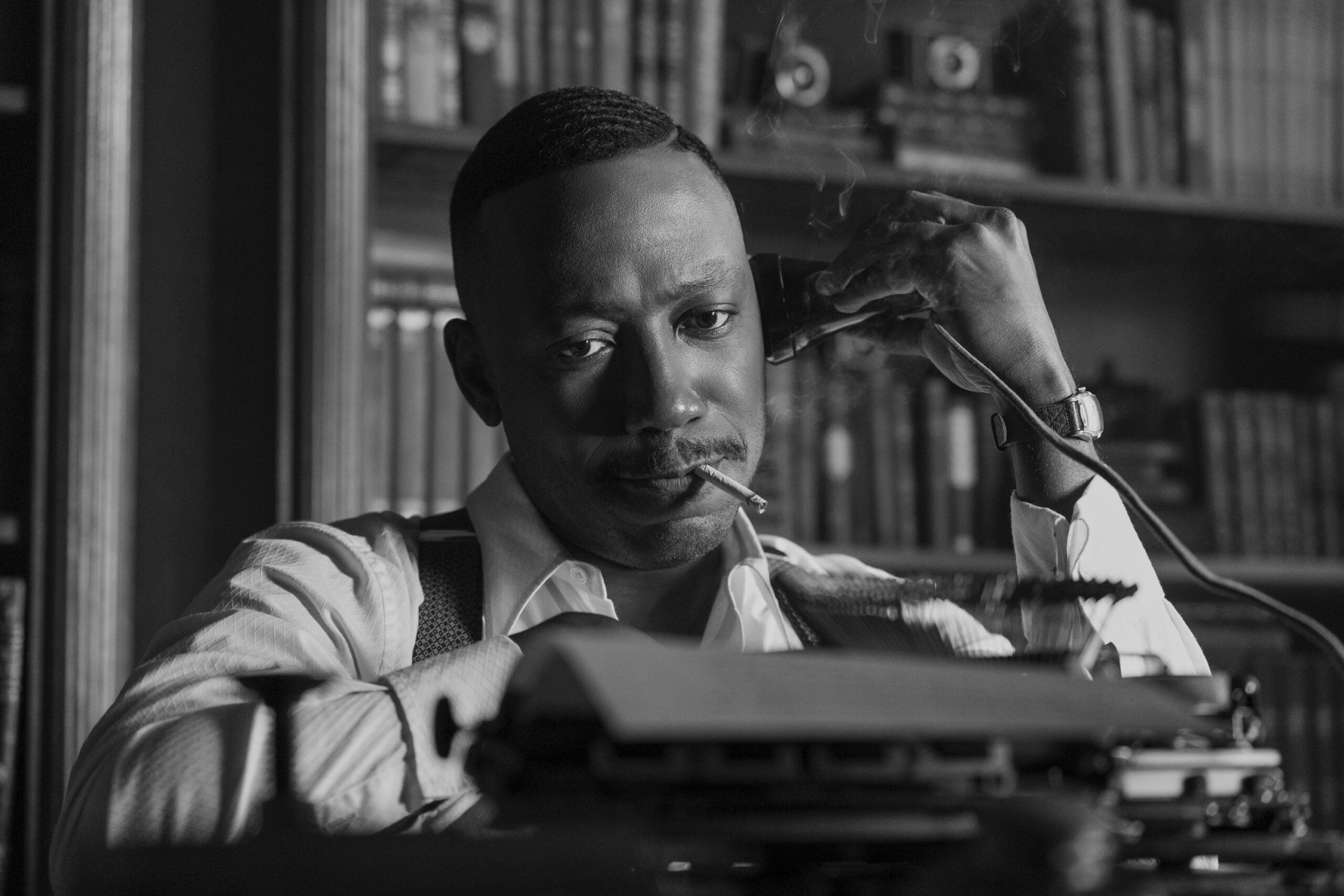 Spider-Noir - Lamorne Morris | Tell-Tale TV Still from black and white version of Spider-Noir of Lamorne Morris as Robbie Robertson. Spider-Noir Review: What if Sam Spade had Superpowers Still from black and white version of Spider-Noir of Lamorne Morris as Robbie Robertson.