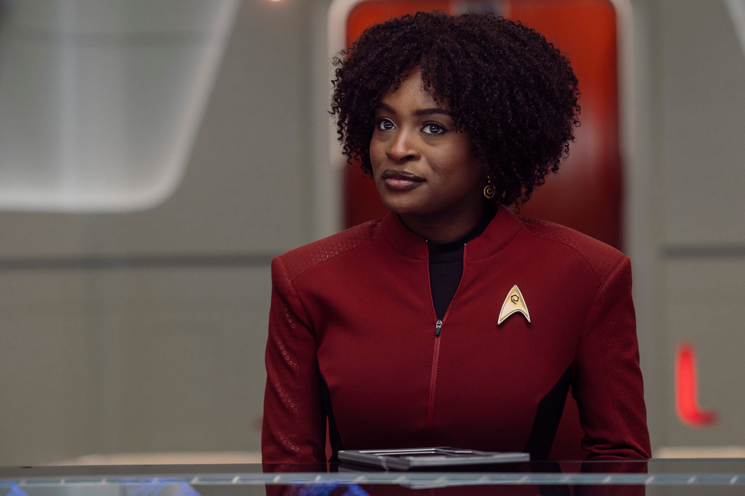 Star Trek: Strange New Worlds Season 4 Episode 1 - Celia Rose Gooding | Tell-Tale TV Still from Star Trek: Strange New Worlds Season 4 Episode 1 of Celia Rose Gooding as Uhura. What to Expect from Star Trek: Strange New Worlds Season 4 Episode 1: Kicking Off With a Wild West Adventure Still from Star Trek: Strange New Worlds Season 4 Episode 1 of Celia Rose Gooding as Uhura.
