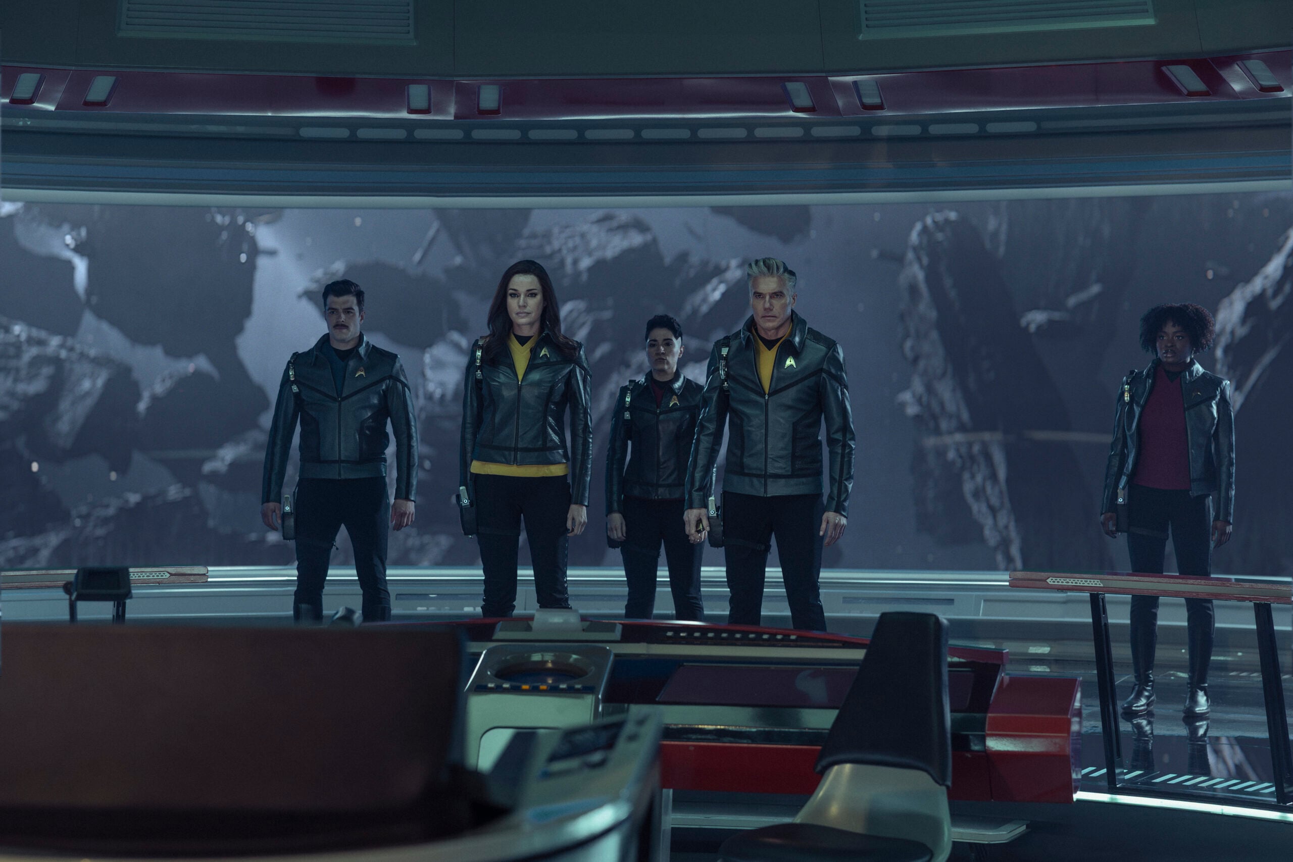 Still from Star Trek: Strange New Worlds Season 4 Episode 2 of Dan Jeannotte as Sam Kirk, Rebecca Romijn as Una, Melissa Navia as Erica Ortegas, Anson Mount as Captain Pike, and Celia Rose Gooding as Uhura pictured from left to right. What to Expect from Star Trek: Strange New Worlds Season 4 Episode 2: Old Mysteries, New Dangers Still from Star Trek: Strange New Worlds Season 4 Episode 2 of Dan Jeannotte as Sam Kirk, Rebecca Romijn as Una, Melissa Navia as Erica Ortegas, Anson Mount as Captain Pike, and Celia Rose Gooding as Uhura pictured from left to right.