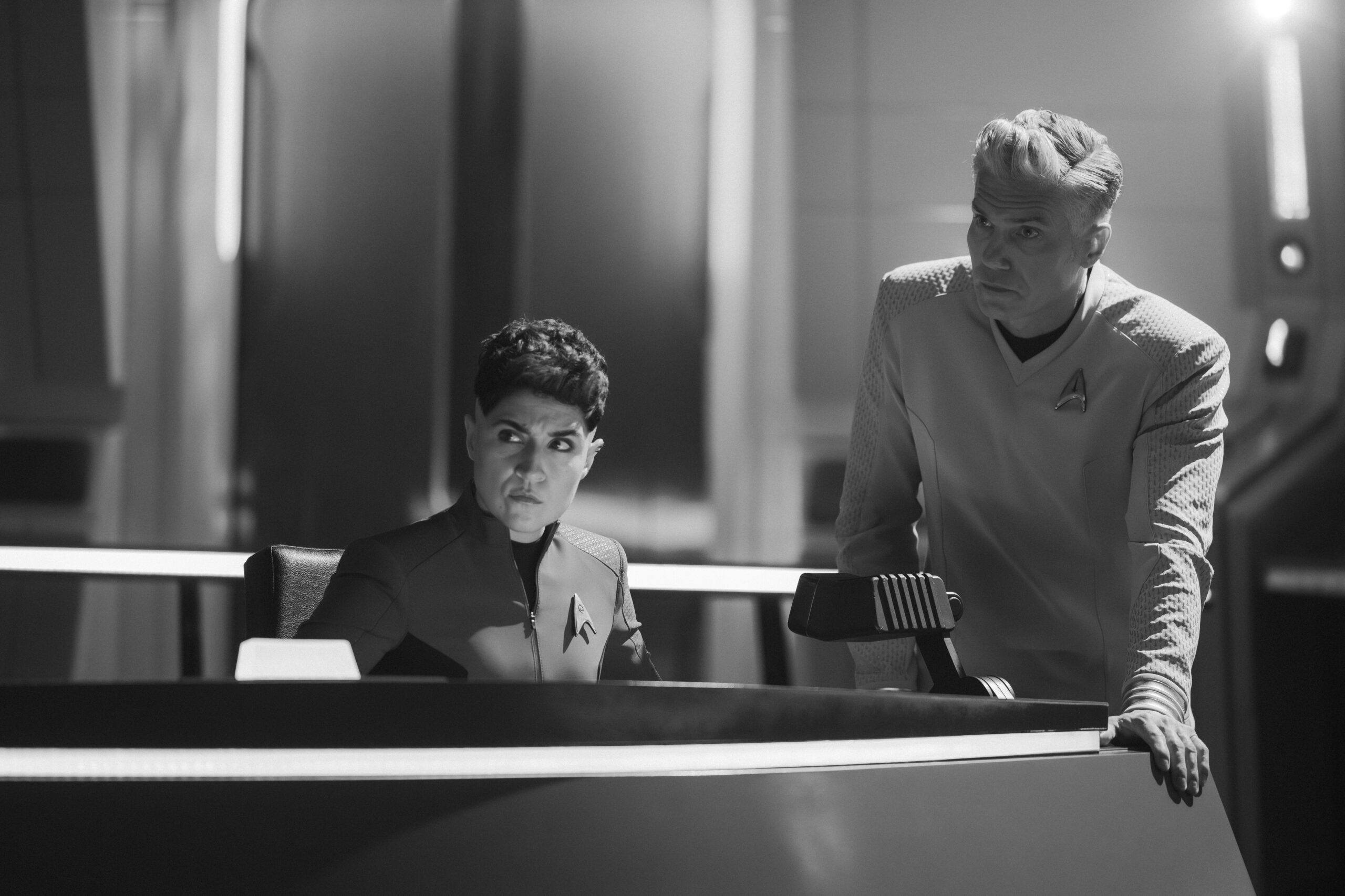 Star Trek: Strange New Worlds Season 4 Episode 4 - Melissa Navia and Anson Mount | Tell-Tale TV Still from Star Trek: Strange New Worlds Season 4 Episode 4 of Melissa Navia as Erica Ortegas and Anson Mount as Captain Pike pictured from left to right. Star Trek: Strange New Worlds Season 4 Episode 4 Preview: Forget it Una, its Klingon Territory Still from Star Trek: Strange New Worlds Season 4 Episode 4 of Melissa Navia as Erica Ortegas and Anson Mount as Captain Pike pictured from left to right.