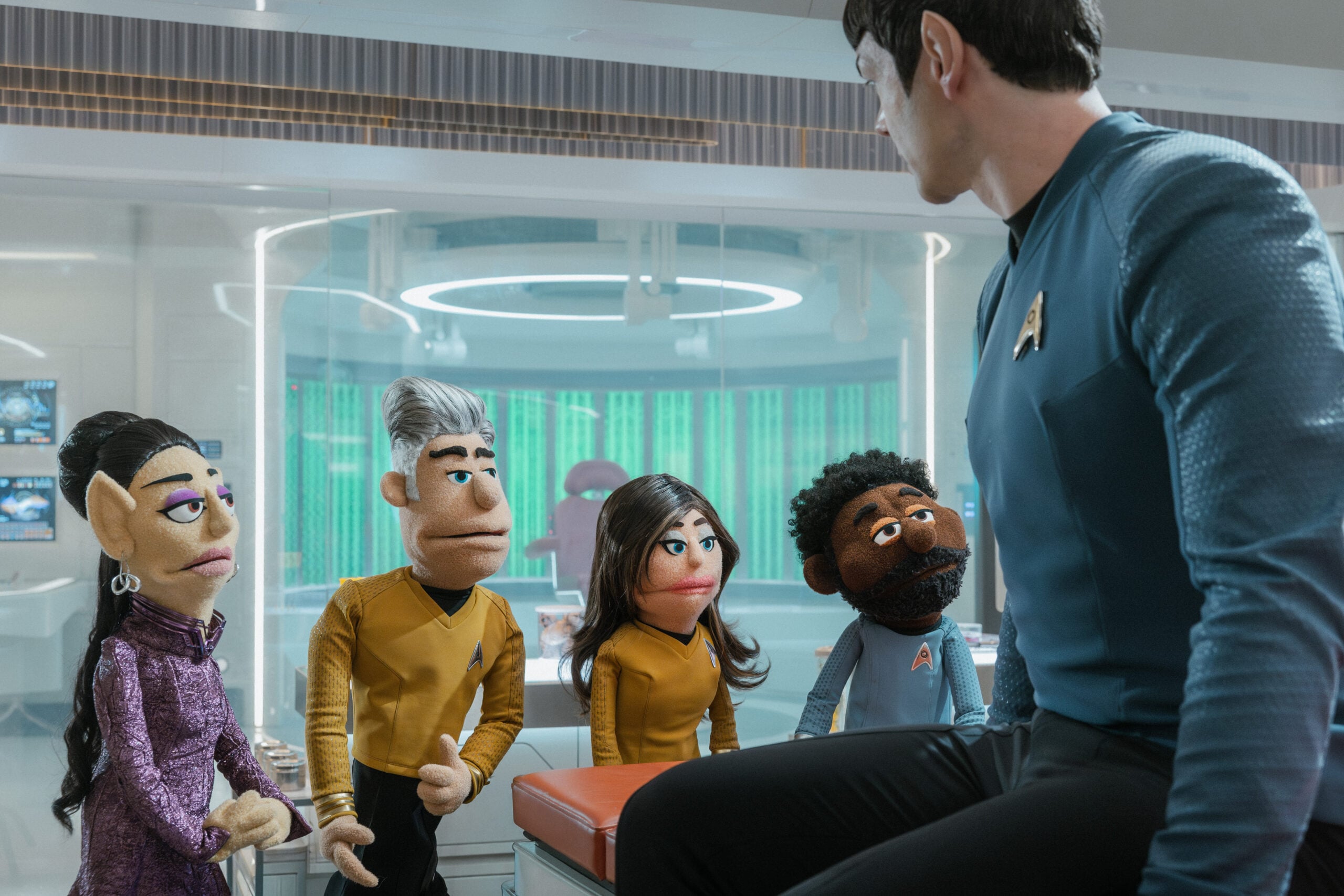 Still from Star Trek: Strange New Worlds Season 4 Episode 5 of Gia Sandhu as T Star Trek: Strange New Worlds Season 4 Episode 5 Preview: Brought to You by The Letter P Still from Star Trek: Strange New Worlds Season 4 Episode 5 of Gia Sandhu as T'Pring, Anson Mount as Captain Pike, Rebecca Romijn as Una, Babs Olusanmokun as Dr. M’Benga, and Ethan Peck as Spock pictured from left to right'Pring, Anson Mount as Captain Pike, Rebecca Romijn as Una, Babs Olusanmokun as Dr. M’Benga, and Ethan Peck as Spock pictured from left to right