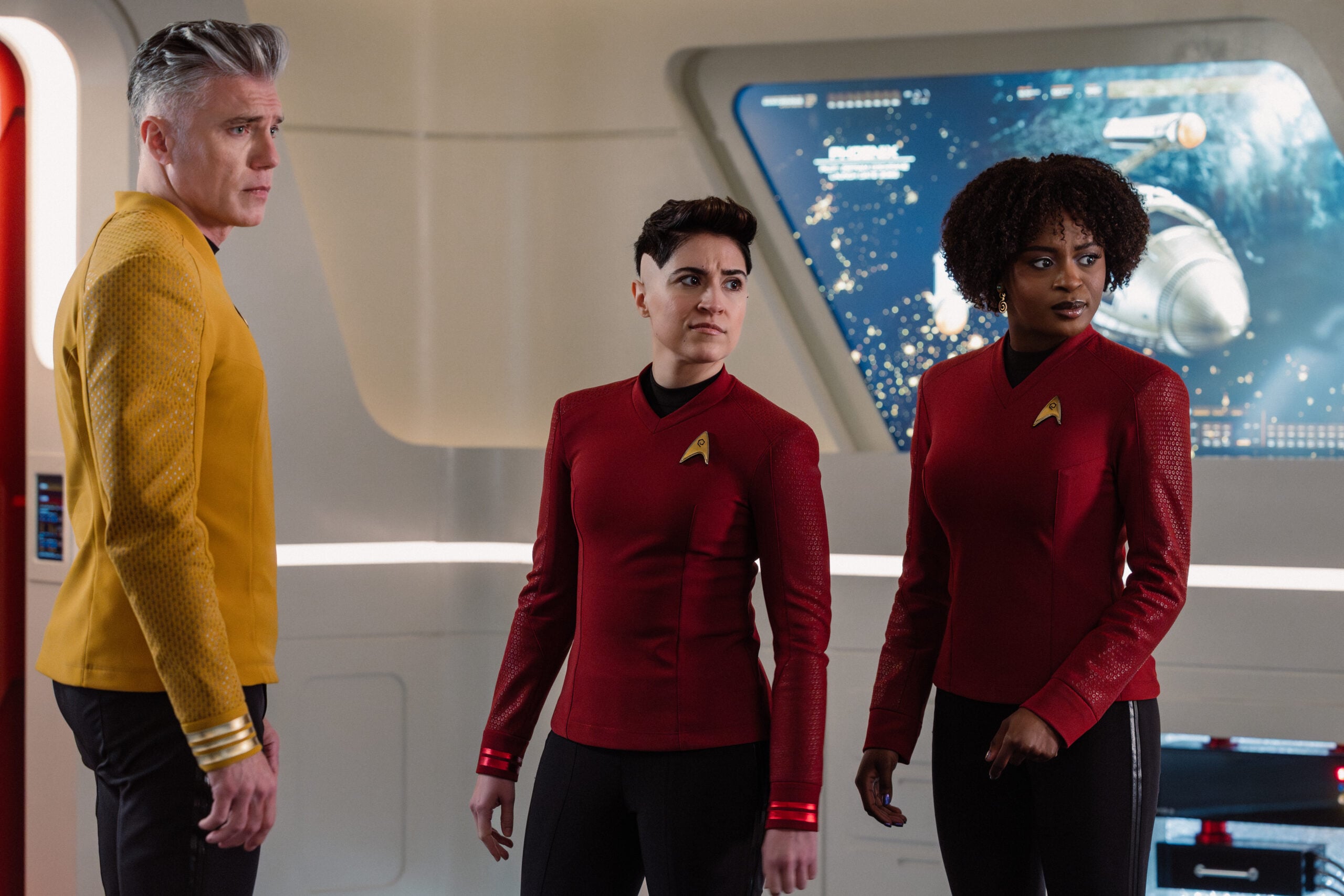 Star Trek: Strange New Worlds Season 4 Episode 6 - Anson Mount, Melissa Navia, and Celia Rose Gooding | Tell-Tale TV Still from Star Trek: Strange New Worlds Season 4 Episode 6 of Anson Mount as Captain Pike, Melissa Navia as Lt. Erica Ortegas, and Celia Rose Gooding as Uhura pictured from left to right. Star Trek: Strange New Worlds Season 4 Episode 6 Preview: Need for Speed Still from Star Trek: Strange New Worlds Season 4 Episode 6 of Anson Mount as Captain Pike, Melissa Navia as Lt. Erica Ortegas, and Celia Rose Gooding as Uhura pictured from left to right.