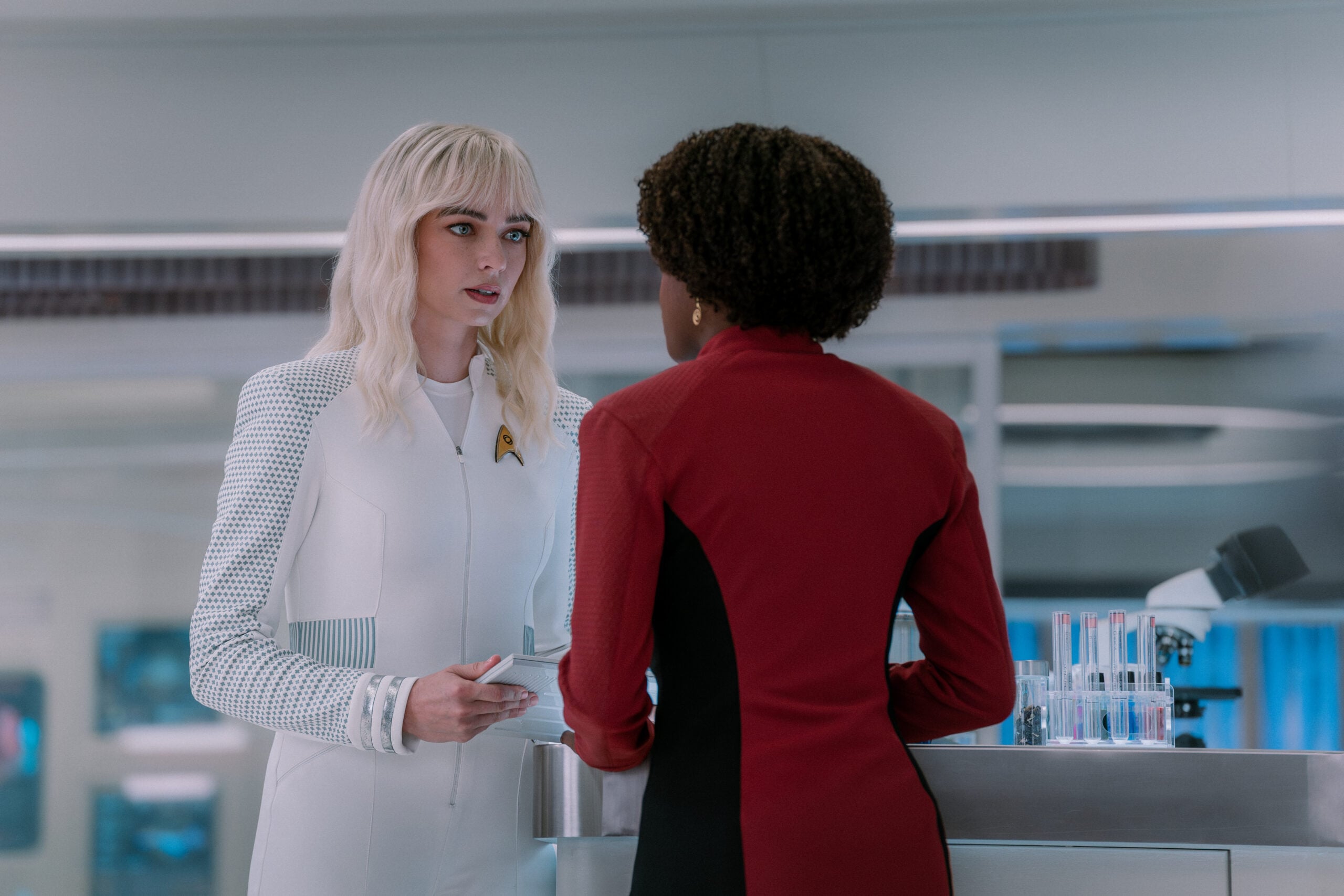 Star Trek: Strange New Worlds Season 4 Episode 7 - Jess Bush as and Celia Rose Gooding | Tell-Tale TV Still from Star Trek: Strange New Worlds Season 4 Episode 7 of Jess Bush as Christine Chapel and Celia Rose Gooding as Uhura pictured from left to right. Star Trek: Strange New Worlds Season 4 Episode 7 Preview: General Enterprise Still from Star Trek: Strange New Worlds Season 4 Episode 7 of Jess Bush as Christine Chapel and Celia Rose Gooding as Uhura pictured from left to right.