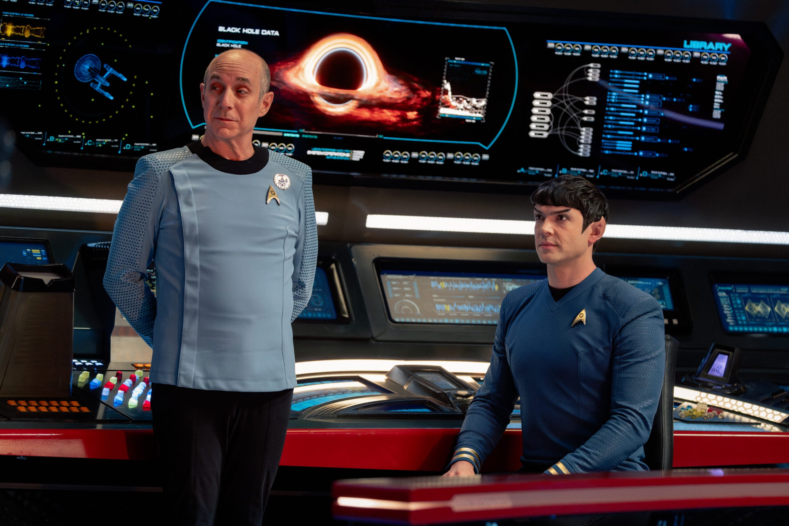 Star Trek: Strange New Worlds Season 4 Episode 10 - Brian Markinson and Ethan Peck | Tell-Tale TV Still from Star Trek: Strange New Worlds Season 4 Episode 10 of Brian Markinson as Dr.Boyce and Ethan Peck as Spock pictured from left to right. Star Trek: Strange New Worlds Season 4 Episode 10 Preview: A Timey Wimey Finale Still from Star Trek: Strange New Worlds Season 4 Episode 10 of Brian Markinson as Dr.Boyce and Ethan Peck as Spock pictured from left to right.