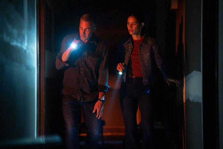 Miranda Rae Mayo as Stella Kidd and Taylor Kinney as Kelly Severide, both holding flashlights in the dark on Chicago Fire Chicago Fire Season 15 Episode 4 Review: A Worthy Adversary