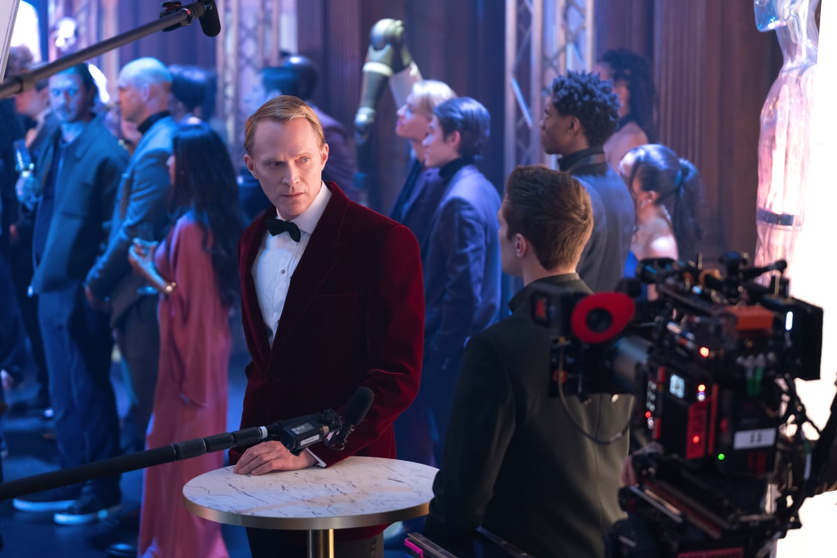 L-R: Paul Bettany and Ruaridh Mollica on the set of Marvel Television's VISIONQUEST, exclusively on Disney+. Photo by Dennys Ilic. © 2026 Marvel. All Rights Reserved. | Tell-Tale TV L-R: Paul Bettany and Ruaridh Mollica on the set of Marvel Television VisionQuest Season 1 Episodes 3 and 4 Review: Expanding Stakes and the Anxieties of Parenting's VISIONQUEST, exclusively on Disney+. Photo by Dennys Ilic. © 2026 Marvel. All Rights Reserved.